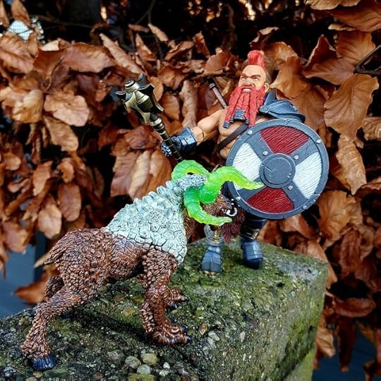 Torgun Redfin fights off a stone monster. 