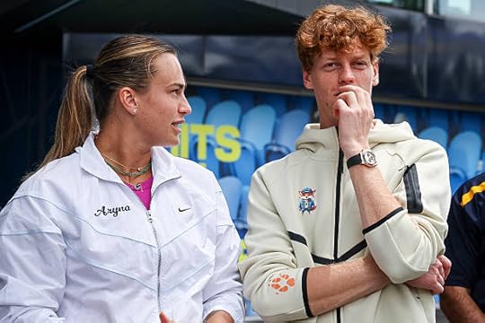 Current Australian Open tennis champions Aryna Sabalenka of Belarus and Italy's Jannik Sinner talk as they wait to participate in an offical ceremony...