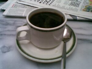 A coffee cup on a table in a cafe.