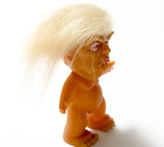 brown and white lion plastic toy