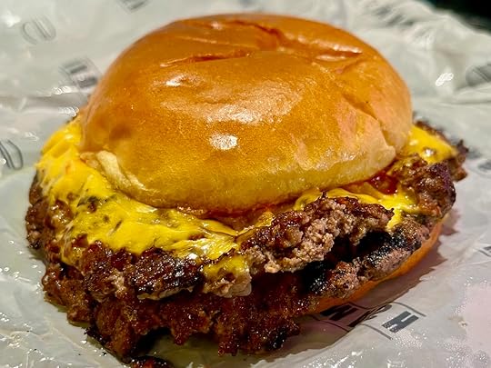 Hausmash Classic Smash burger with American cheese diced onions ketchup and mustard in Wellington, Florida