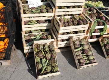 a market stall of artichokes