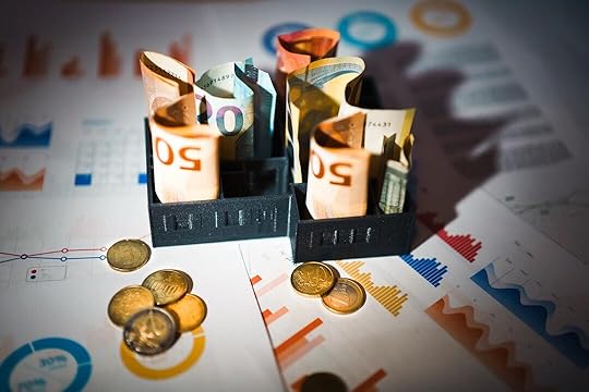 A pile of money sitting on top of a table