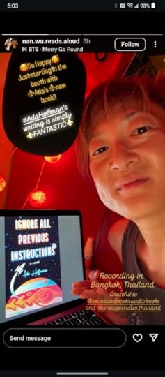 Screenshot from n.wu.reads.aloud on Instagram. Nancy Wu, a Chinese woman in a tank top, poses in front of a red backdrop with a laptop showing the cover art of Ignore All Previous Instructions. Yellow lanterns can be seen overhead. Bubbles of text in the image say: 