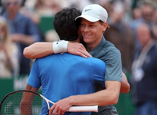 Jannik Sinner of Italy hugs Carlos Alcaraz of Spain after winning the Final match against Carlos Alcaraz of Spain on day Eight of the Rolex...