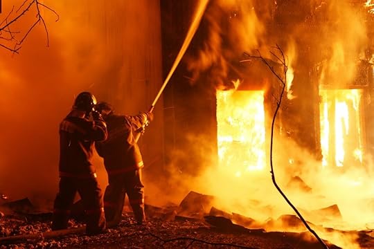Two firefighters battle flames engulfing a home with a single hose.