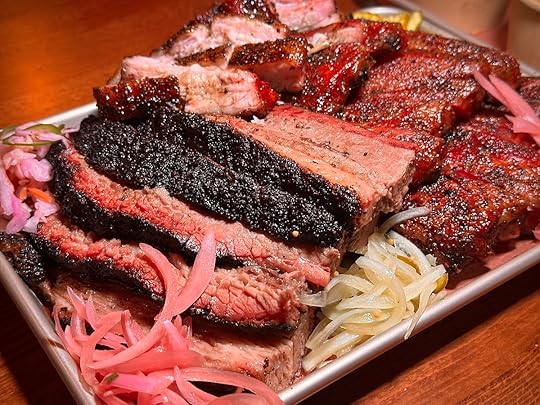 La Traila BBQ Miami brisket slices with ribs and pickled onions on tray