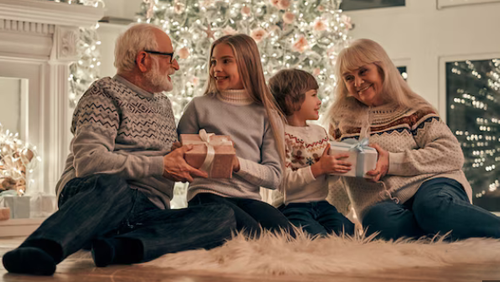 kids and grandparents in front of the xmas tree