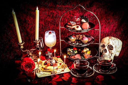 Tokyo's Vampire Cafe, blog post by Aspasia S. Bissas, aspasiasbissas.com. Image is a table covered in candles, a skull, 