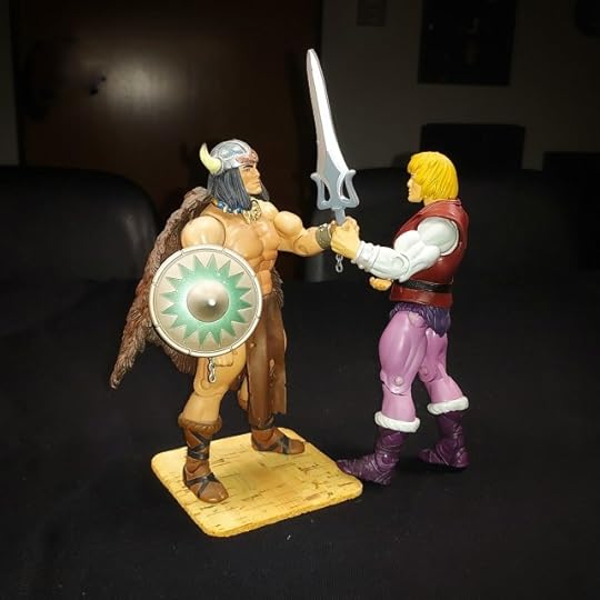 Adam tries to take the sword from Vikor's hand