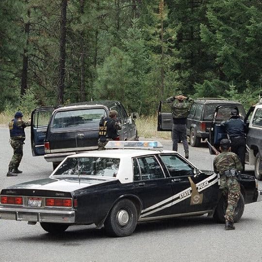 Federal law enforcement draws their weapons. 