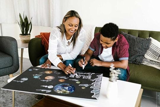 woman and boy doing a poster together