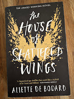 Cover of The House of Shattered Wings by Aliette de Bodard, showing a golden pattern like angel wings on a black background