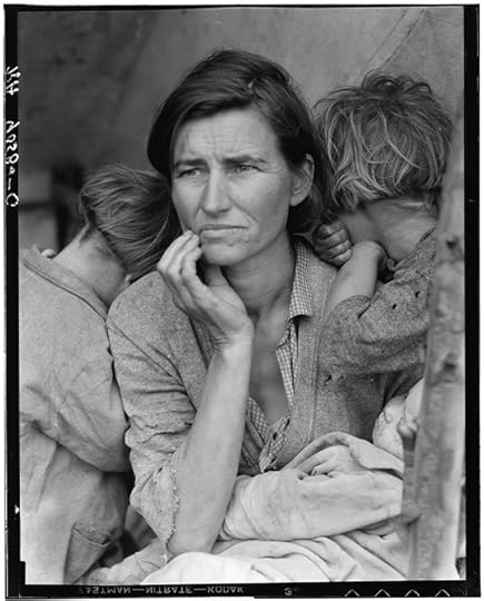 Black and white photo of a tired woman, gazing forward with a look of understated worry, seated in a tent. She has a child on either side of her, with heads turned away from the camera.