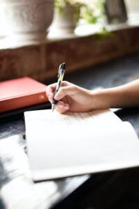 person signing a book
