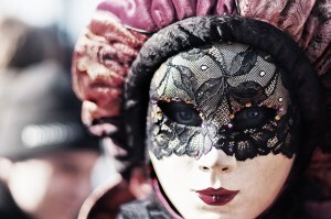 Woman wearing a Carnival mask in Italy.