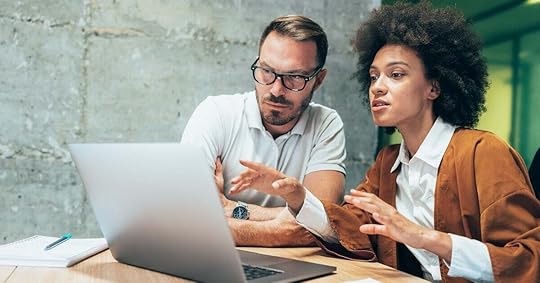 A sales manager and seller review opportunities in the pipeline.