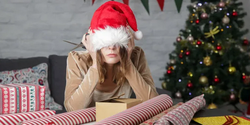 woman wearing santa hat pulled over eyes