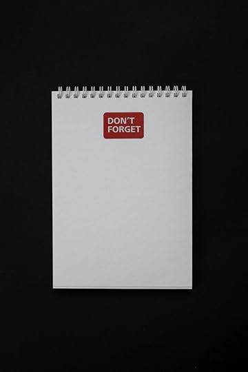 notebook with sticker on black background