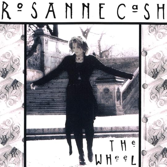 A black and white album cover, with the artist's name at the top and a photo of her outside, dancing, arms outstretched and her eyes down, in the center.
