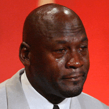 a man in a suit and tie is crying with tears coming out of his eyes