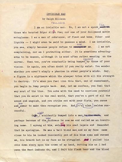 A typeset page of copy on aged, brown paper, with editing marks made by a red pencil. It is titled 