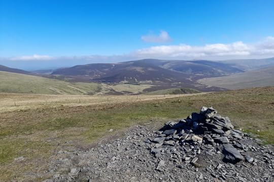 The stony summit cairn of Lonscale Fell.