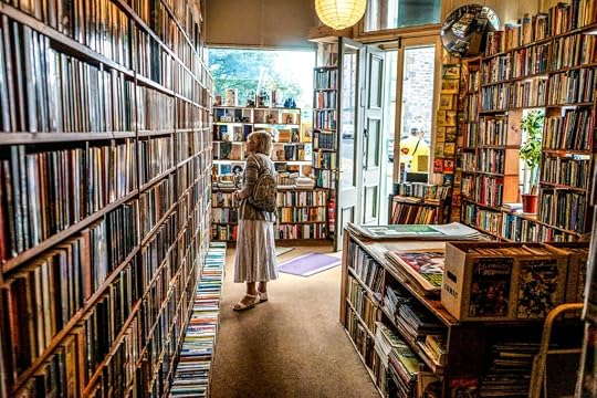 A woman in the interior of a bookstore