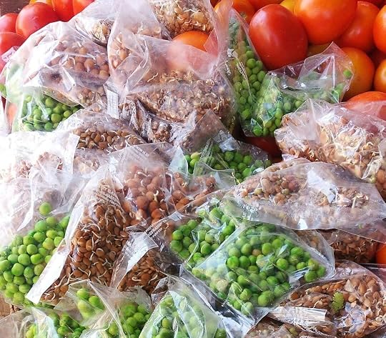 a pile of bags filled with lots of different types of vegetables