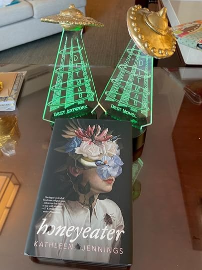 Now the tractor beams are green! Two UFO trophies (best artwork and best novel) and a copy of Honeyeater