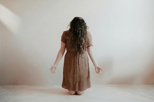 Woman surrendering and praying and if not he is still good
