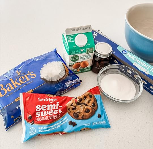 Five ingredients for easy chocolate macaroons — sweetened shredded coconut, egg whites, granulated sugar, vanilla extract, and semi-sweet chocolate chips