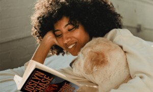 Girl with dog reading Nocturne in Ashes, high res