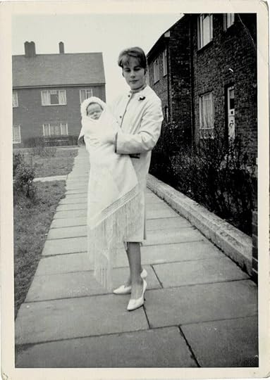 Outside my first home, with my mother