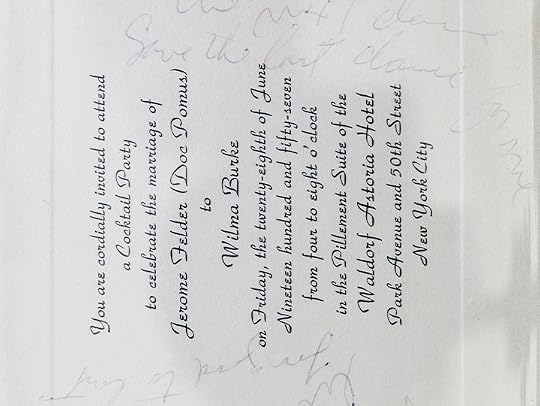 Close-up of a beige invitation to a wedding reception, turned sideways. There is faint writing in pencil around the typed wording.