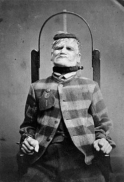 Man in restraint chair; by H. Clarke; 1869