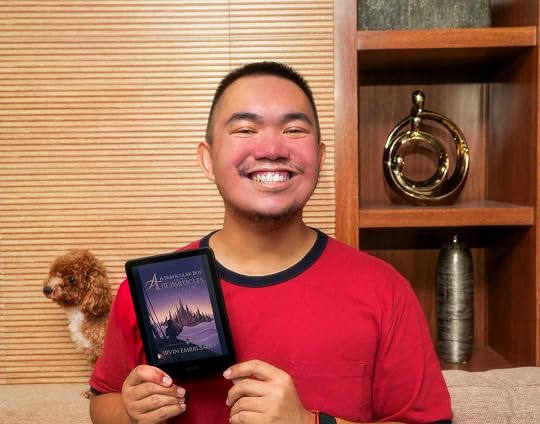 Photo of me with my book loaded on Kindle... and Kendra posing behind me