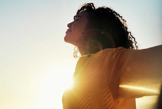 Woman getting early morning sun.