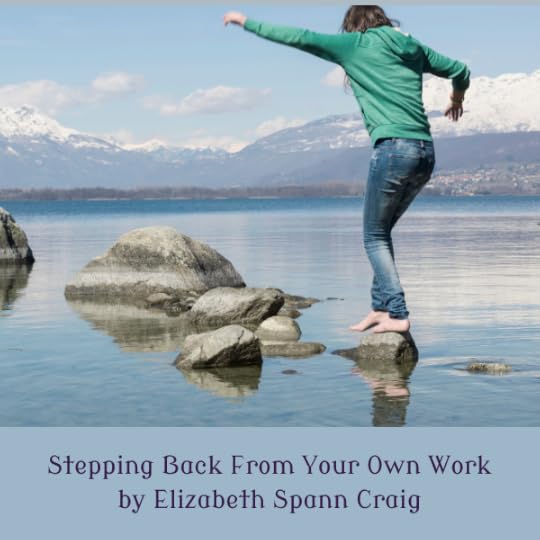 Woman precariously stepping across stepping stones in a lake