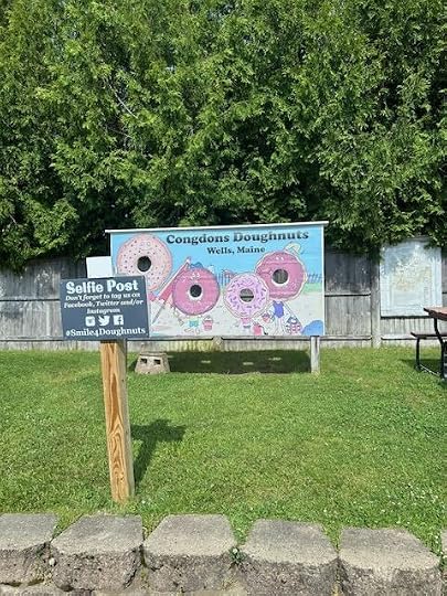 Condon's Doughnuts selfie stand in the parking lot of the bakery.