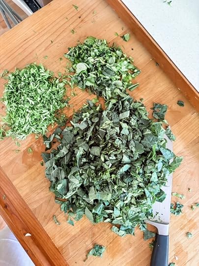 The chopped carrot tops and kale 
