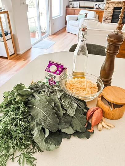Ingredients for creamed kale and carrot tops including kale, carrot greens, shallot, garlic, fresh basil, Parmigiano Reggiano, and half and half