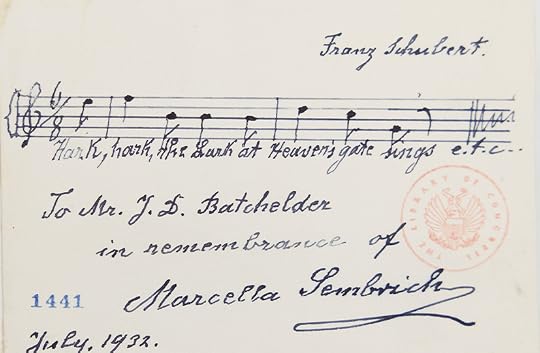 A few bars of a musical staff, with musical notations and lyrics, above a signature.