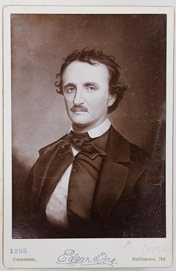 Half-length photo portrait of Edgar Allan Poe, turned slightly to his right and facing the camera with a somber expression.