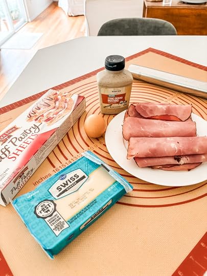 Five ingredients for ham and cheese strudel — puff pastry, deli sliced ham, shredded Swiss cheese, stoneground mustard, and an egg yolk