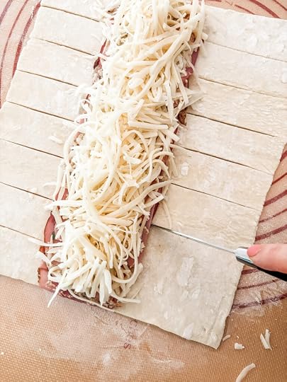 Making perpendicular cuts into the pastry