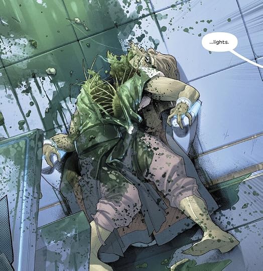 panned out shot of our victim secured to a chair while their stomach has been gruesomely torn open. Green blood covers the body and the wall behind them.