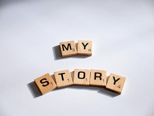 two scrabbled wooden blocks spelling the word my story