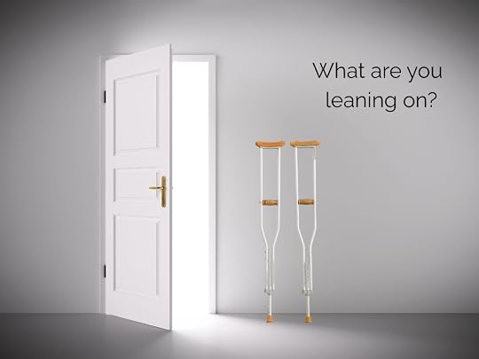 Unused crutches beside an open doorway, representing letting go of collective control