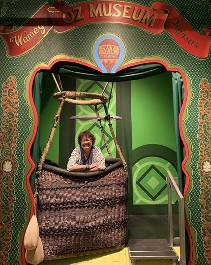 DA Henneman visits the Oz Museum and takes a picture in the wizard's balloon